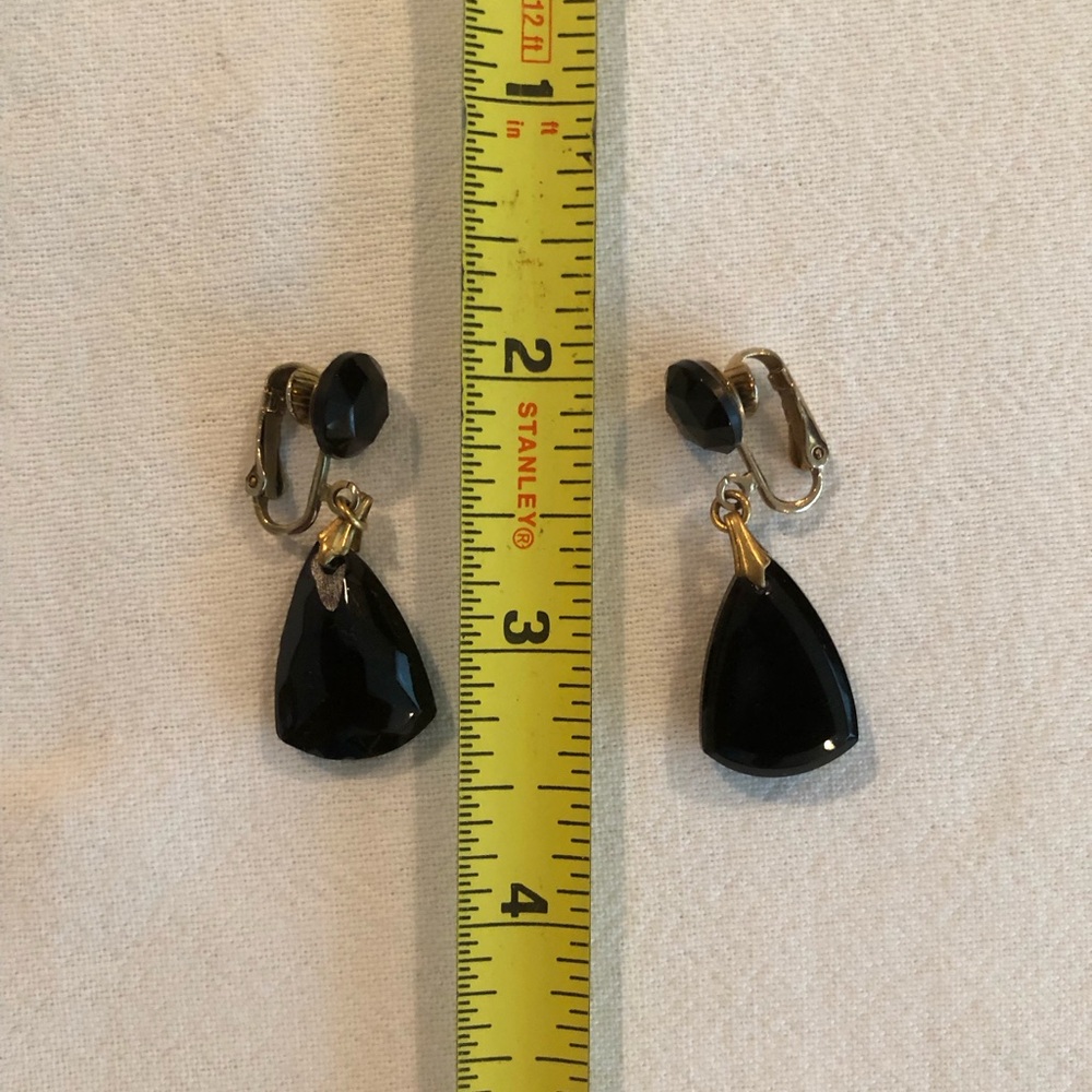 Black and gold tone clip on dangle earrings